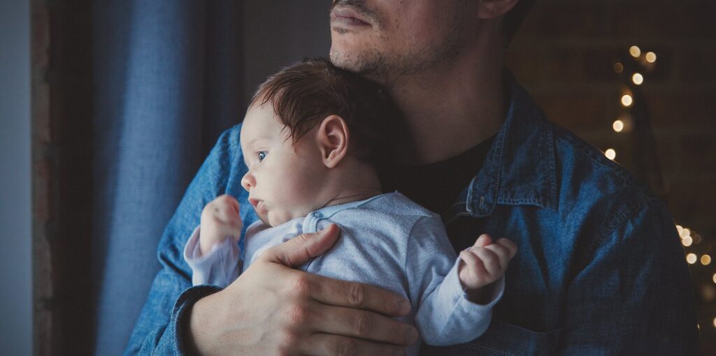 father holding a child